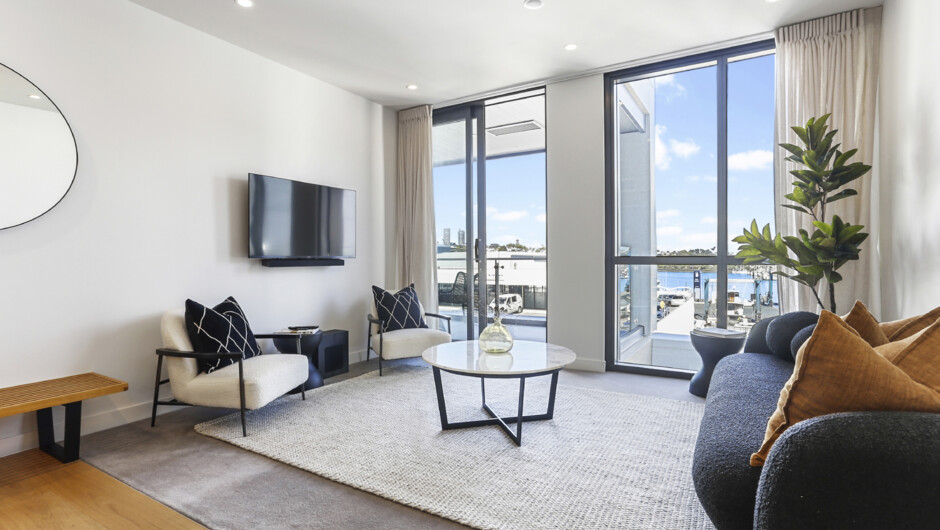 Stylish living area flows out to the covered balcony