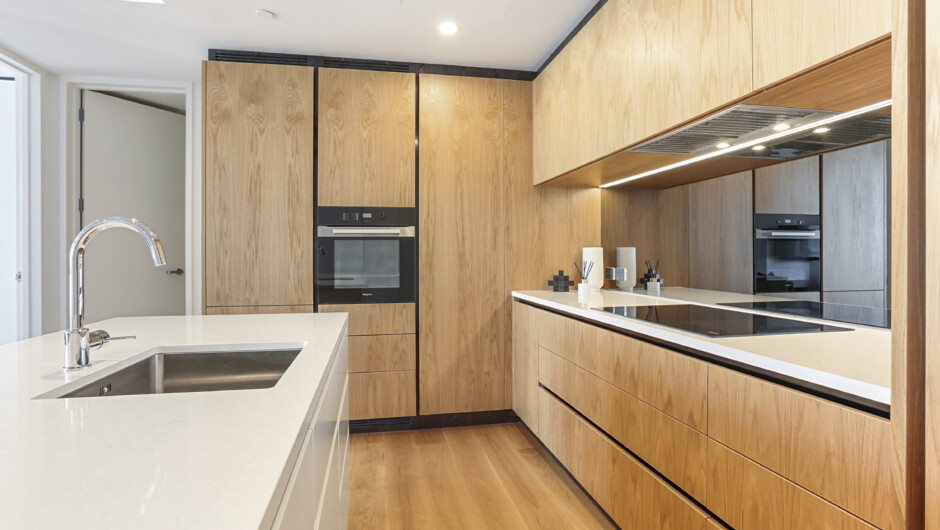 Spacious kitchen comes equipped with cooking basics and modern appliances