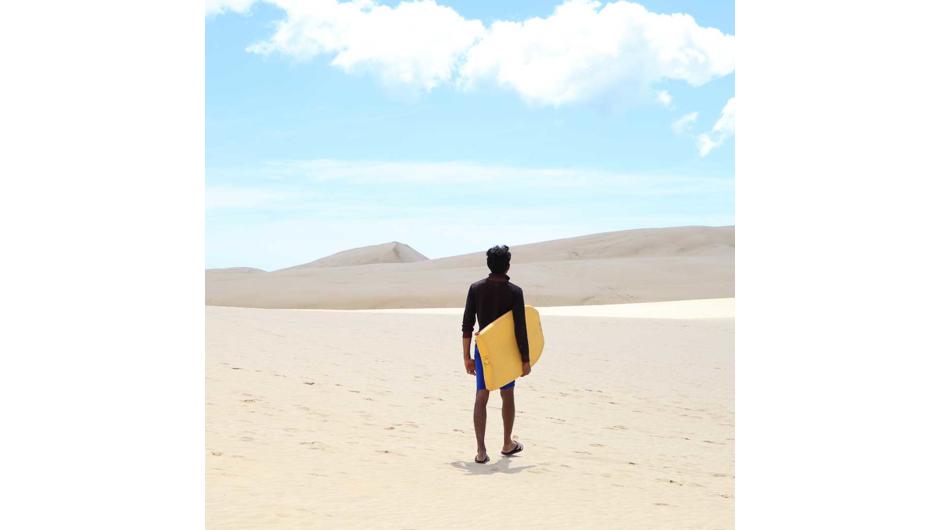Sandboarding at the Sand Dunes in Cape Reinga