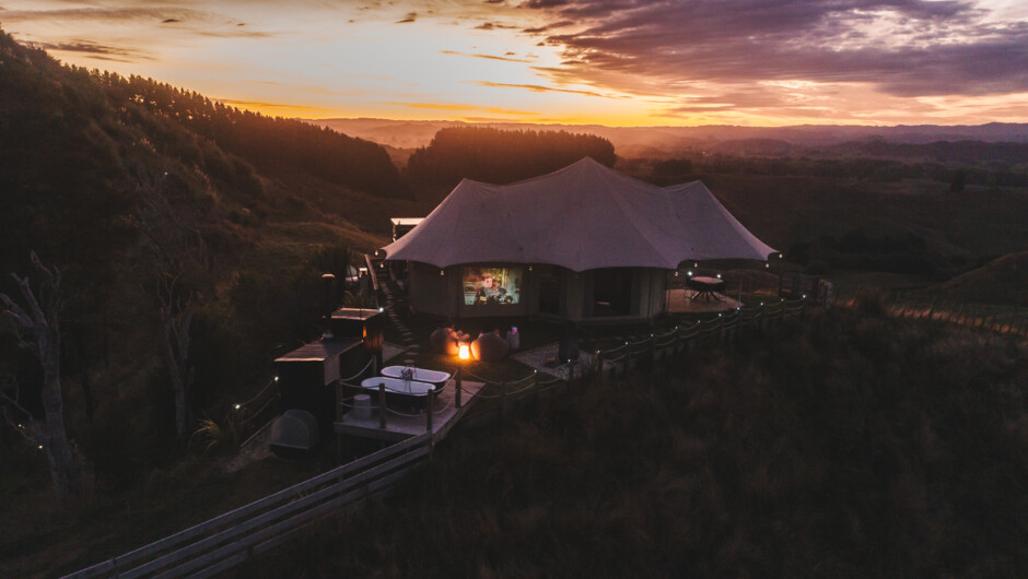 Waitomo hilltop glamping with stunning 360 degree views, outdoor baths and an outdoor movie projector.