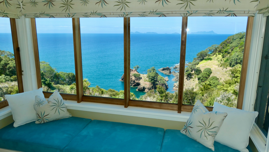 The Guesthouse bedroom views. Waterfront with private beach.