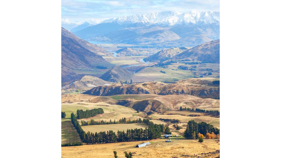 Head over New Zealand's highest sealed road, Crown Range Road before dropping into Queenstown.
