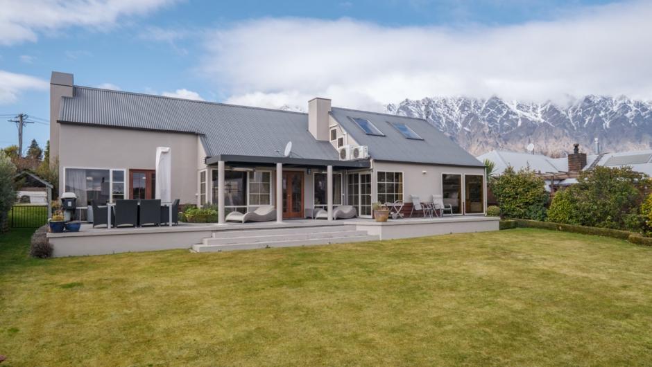 Full exterior view with the picturesque Remarkables Mountains in the background.