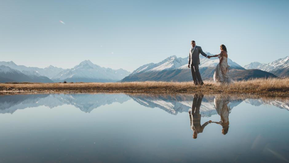 Bride and groom in front of Aoraki Mt Cook at Mt Cook Lakeside Retreat