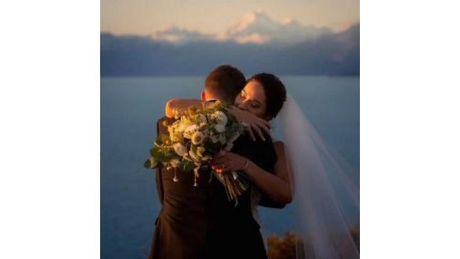 Bridal couple on the wedding lawn at Mt Cook Lakeside Retreat