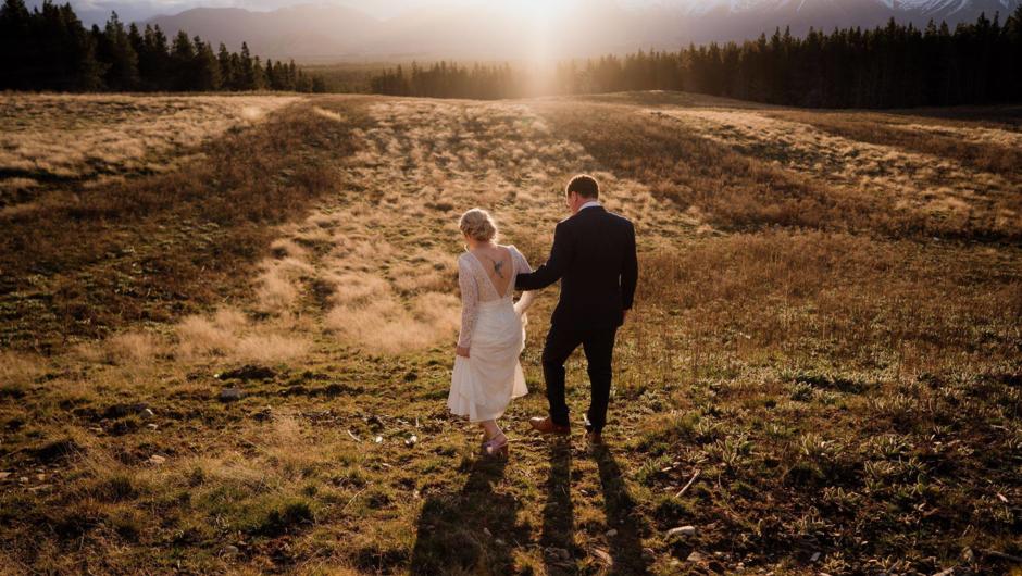 Bridal couple on lawn in front of Moraine Lodge
