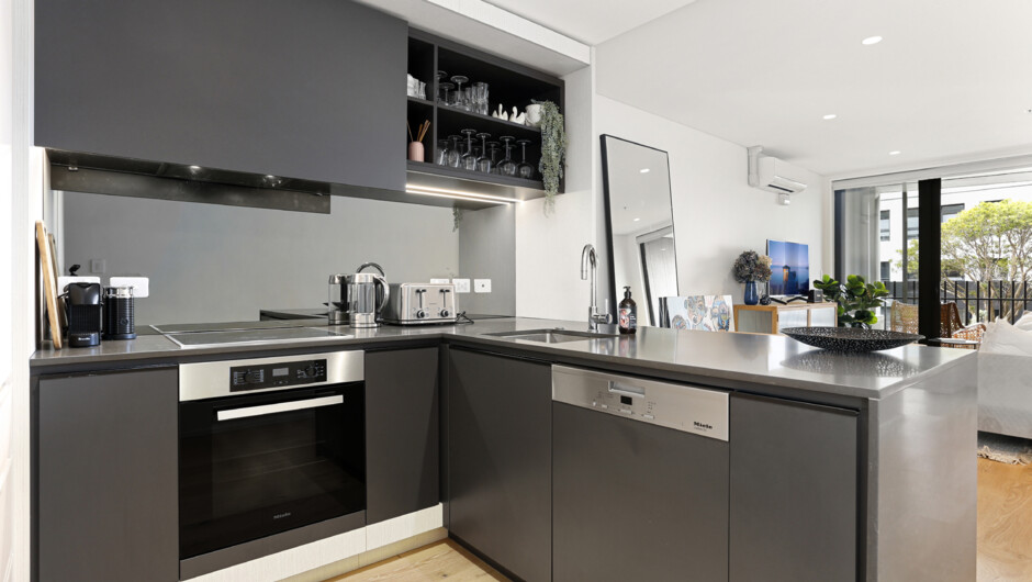 Kitchen comes equipped with modern appliances.