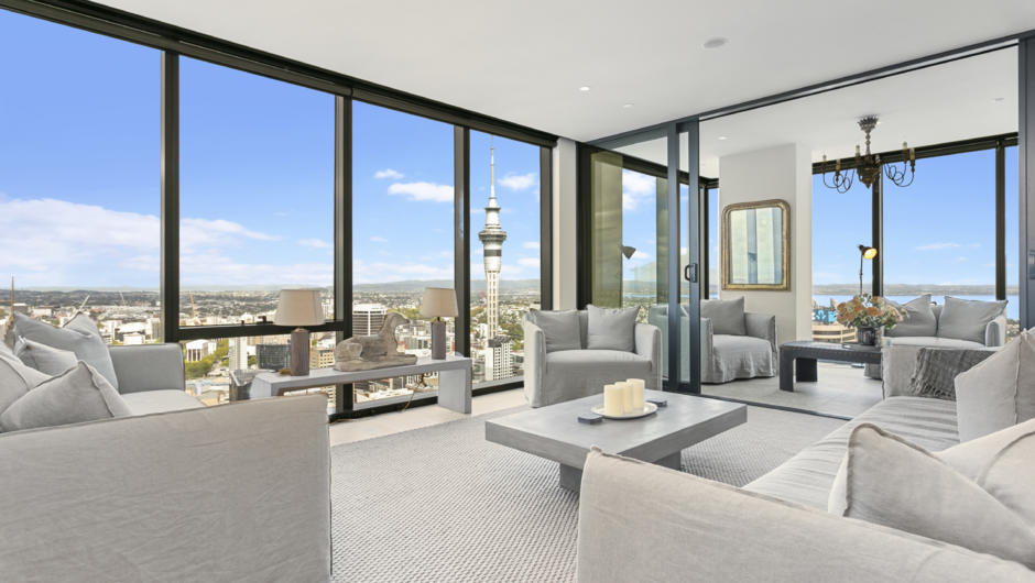 Spacious living area with stunning views of the city and Sky Tower