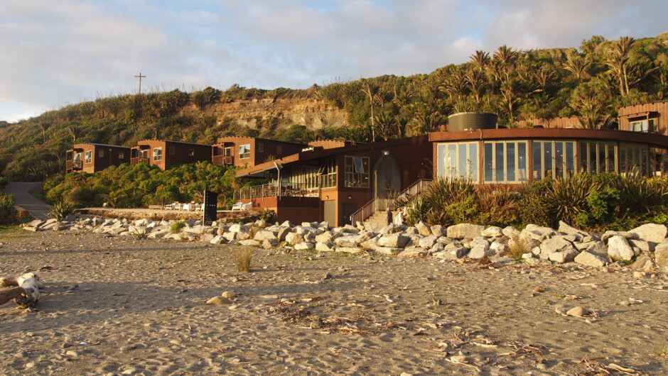 View of the property entrance, restaurant and bar from the beach.