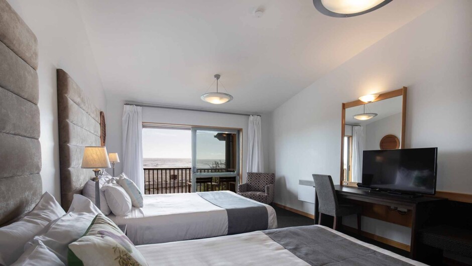 Beach View Room (balcony option), two queen beds, en-suite.
