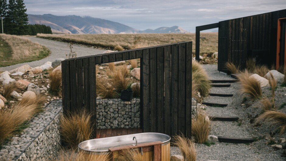 The hot tub is situated for privacy with beautiful views, and includes an outdoor changing area