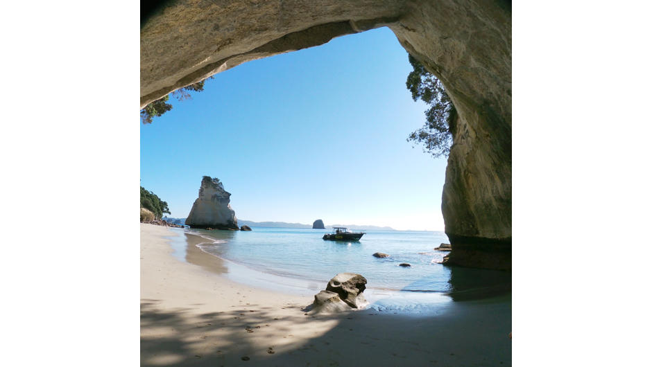 One of our vessesls - The Mystery Machine - anchored at Cathedral Cove on a beautiful day.