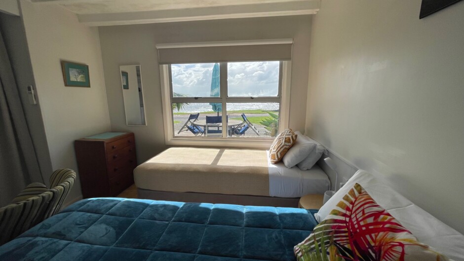 Paua Family Apartment with queen bed and 3 singles at Driftwood Beachfront Accommodation, Cable Bay, near Coopers Beach, Northland.