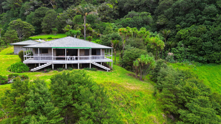 Drone view of the Lodge, nestled in native forest.