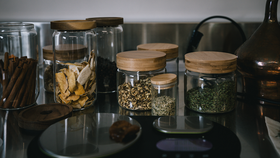 Botanicals in jars ready to be measured.