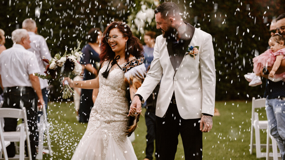 Celebrating being husband and wife after their wedding ceremony at Allely Estate in Auckland