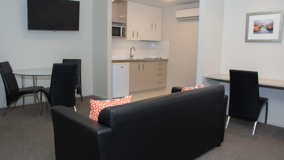 One-bedroom Apartment, king bed in bedroom, single bed in lounge, work station, heat pump and double glazing