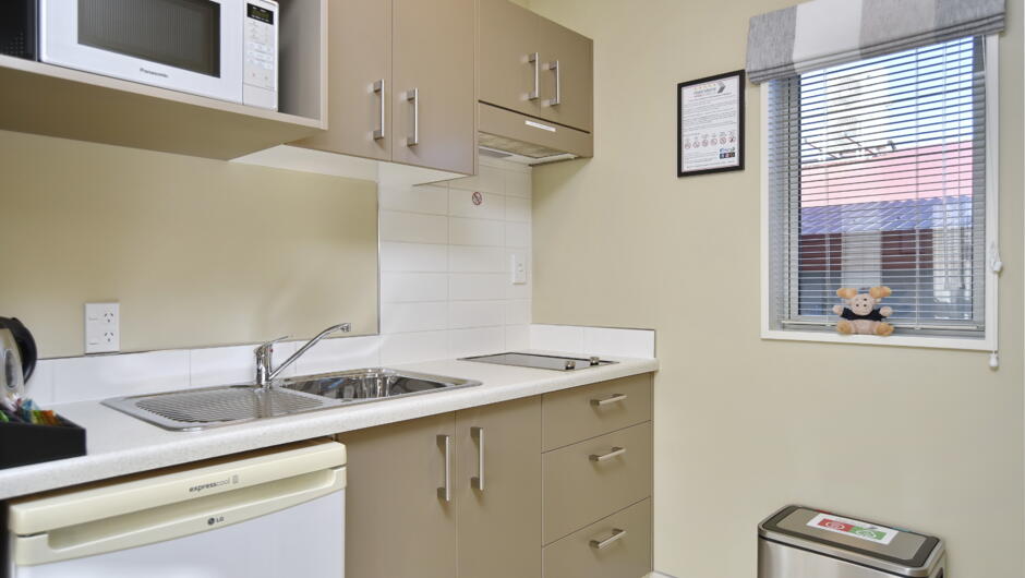 The well-equipped kitchenette in a studio room. All rooms have a fridge, hob, microwave, kettle & toaster and plenty of crockery, cutlery and utensils.