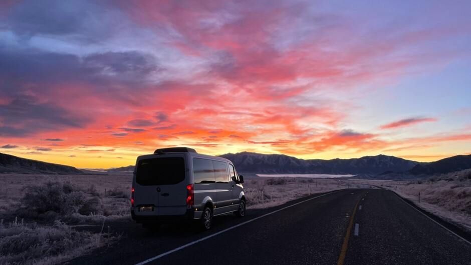 Van on the road with sunset