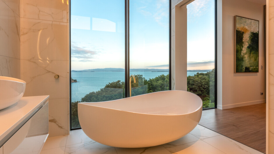 Indulge in pure relaxation with an oversized bath and mesmerizing sea views at Villa Haven.