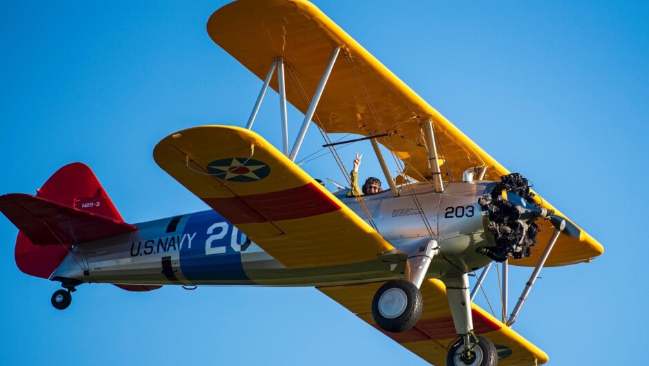 The Boeing Stearman flying over Mount Maunganui