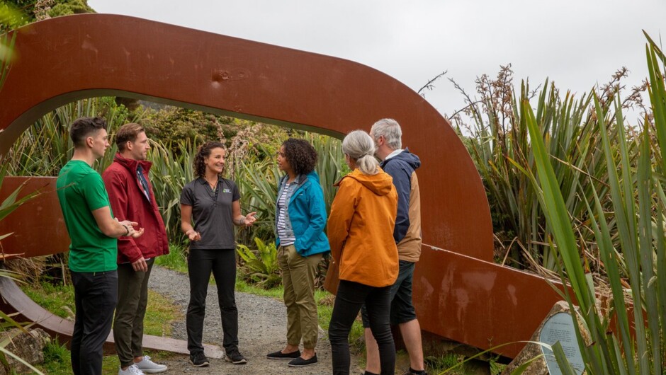 Glenorchy Air&#039;s Stewart Island Ultimate Day Experience passengers at the start of the Rakiura Track, a stop off on the Real NZ Stewart Island Village &amp; Bays Tour