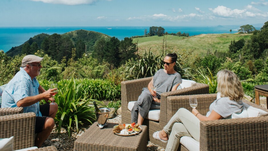 Take in endless ocean vista and views down to Mauao | Mount Maunganui as you enjoy your welcome platter and wine on arrival