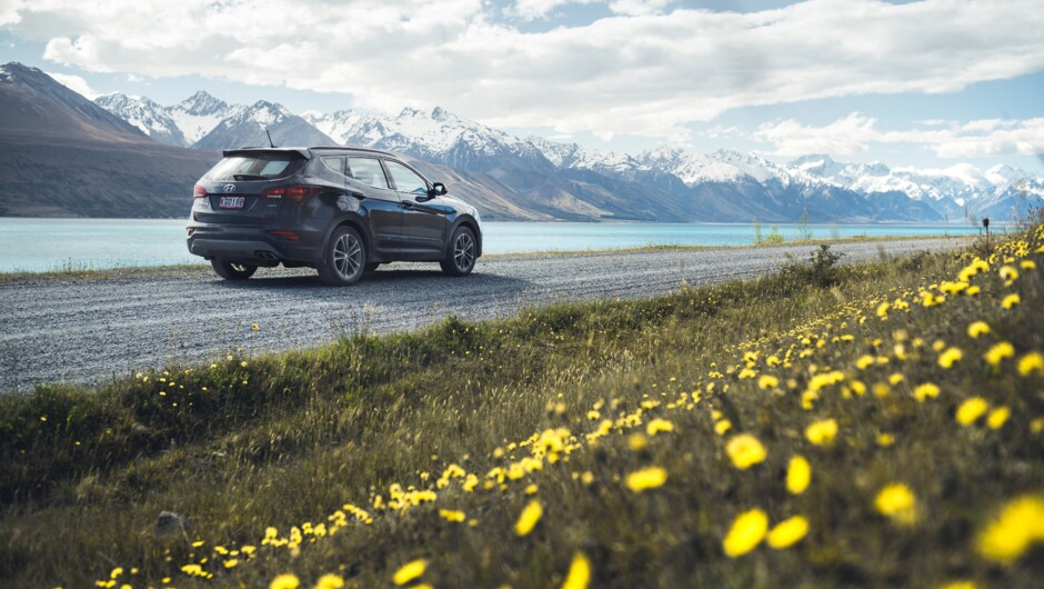 GO Rentals vehicle driving along Lake Pukaki road.