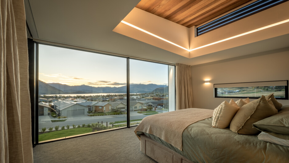 Master bedroom with lake and mountain views