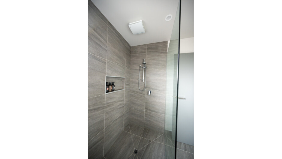 Each private shower room features a spacious walk-in shower for easy access. We also have a warm outdoor shower, for guests coming straight from the beach.