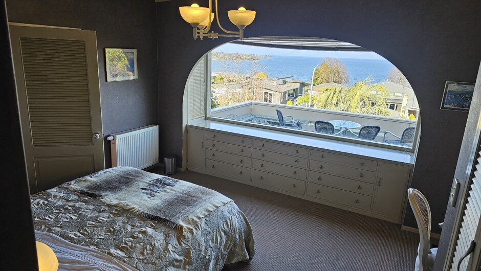 The Lake Room (the original master) with ensuite, has has a queen bed and thermal radiator; and private access to the front deck and thermal bath.