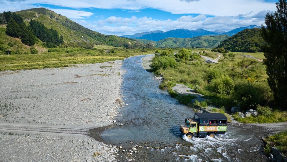 Our custom built Unimog crossing the braided Kahutara River