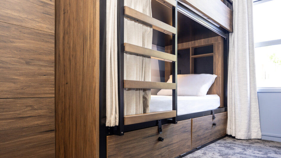 Multi Share dorm rooms:  lockers, privacy curtains, bedside light and charging facilities.