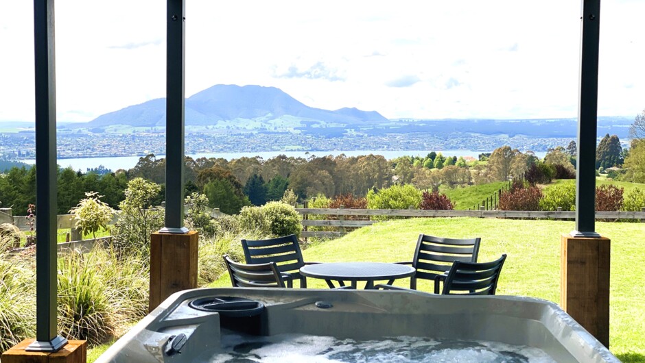 An outdoor spa oasis, offering breathtaking views of Taupo town, Lake Taupo, and the majestic Mt. Tauhara. Equally mesmerising at night, with the town&#039;s dazzling lights.