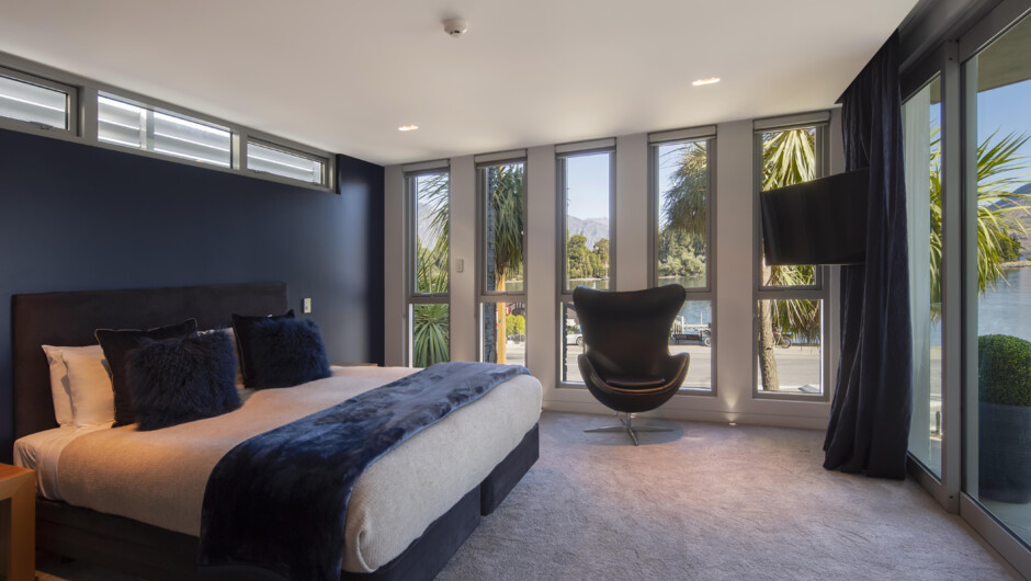 Master bedroom has a lakefront view and access to the main balcony.