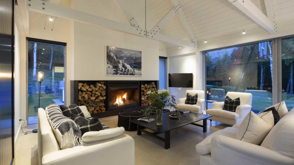 The spacious bright living area is filled with natural light and a luxurious mountain vibe.