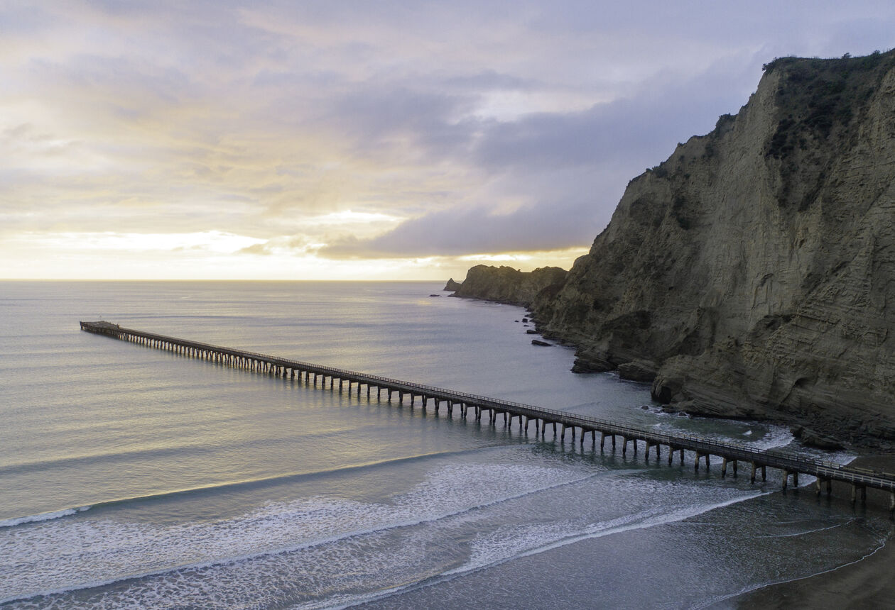 Enjoy a slice of East Cape history by taking a 30-minute stroll to the end of Tolaga Bay wharf and back. 