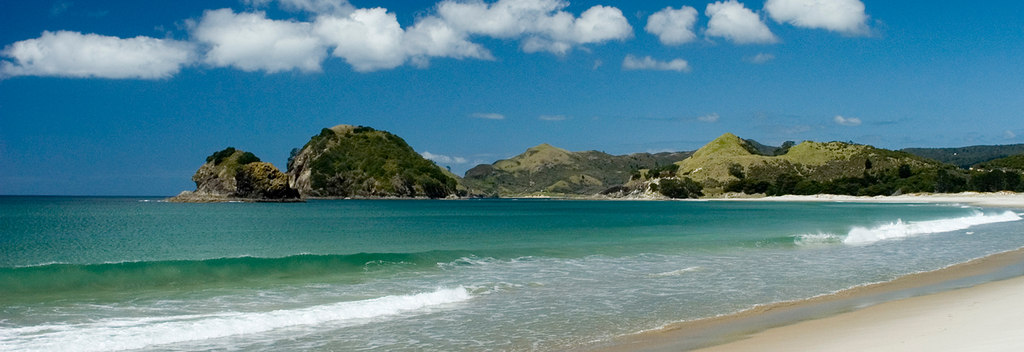 Great Barrier Island is a world away from Auckland City. It&#039;s white sand beaches promise to beckon you for a swim.