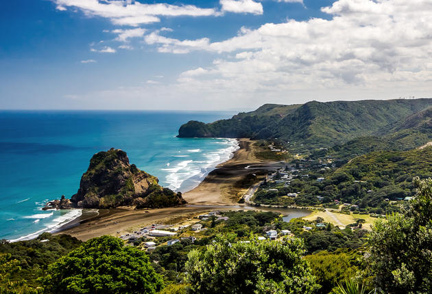 Piha is a scenic black-sand surf beach on the rugged coast west of Auckland. There are several walks through native forest in the surrounding hills.