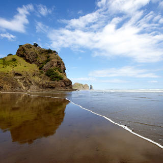 The majestic ‘Lion Rock’ stands guard over Piha beach