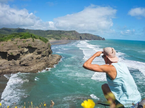 Watching the break at Bethells Beach on Auckland&#039;s west coast, just half hour drive from the city centre.