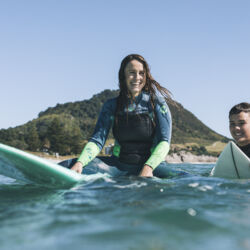 Taking a surfing lesson at Mount Main Beach
