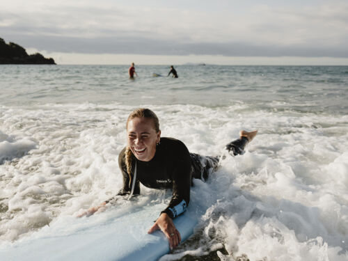 Surfing at Mt Maunganui main beach