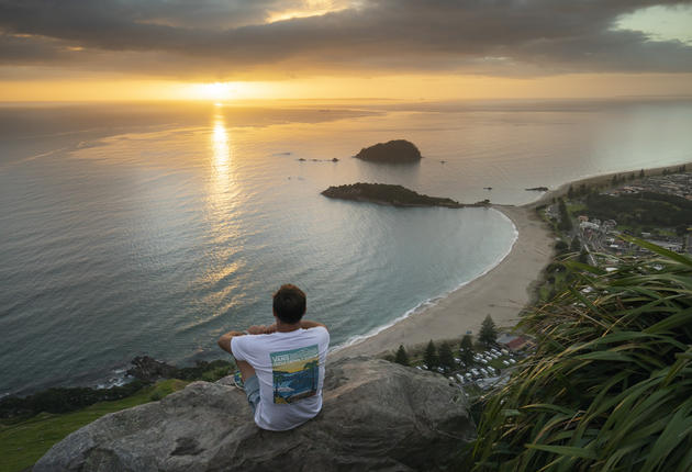 Mount Maunganui - From the base of the volcano Mauao, a white sand surf beach stretches as far as the eye can see. Catch a wave or cruise the many cafes.