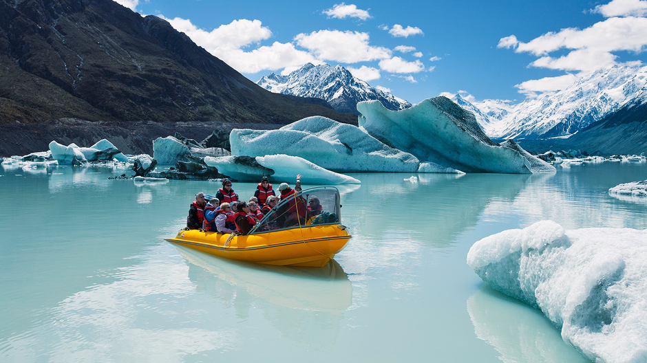 Glacier Explorers take visitors to see the Tasman Glacier and touch floating ice