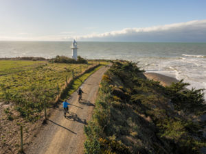 People riding bikes at Jack's Point Lighthouse, Timaru