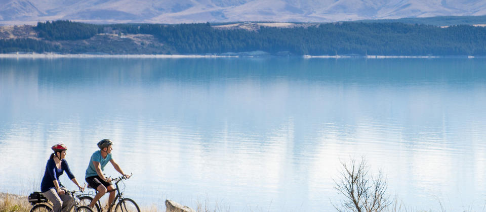 The Alps 2 Ocean Cycle Trail follows alongside Lake Pukaki. Created by ancient glaciers, Lake Pukaki is one of three lakes along the northern edge of the MacKenzie Basin in the South Island.