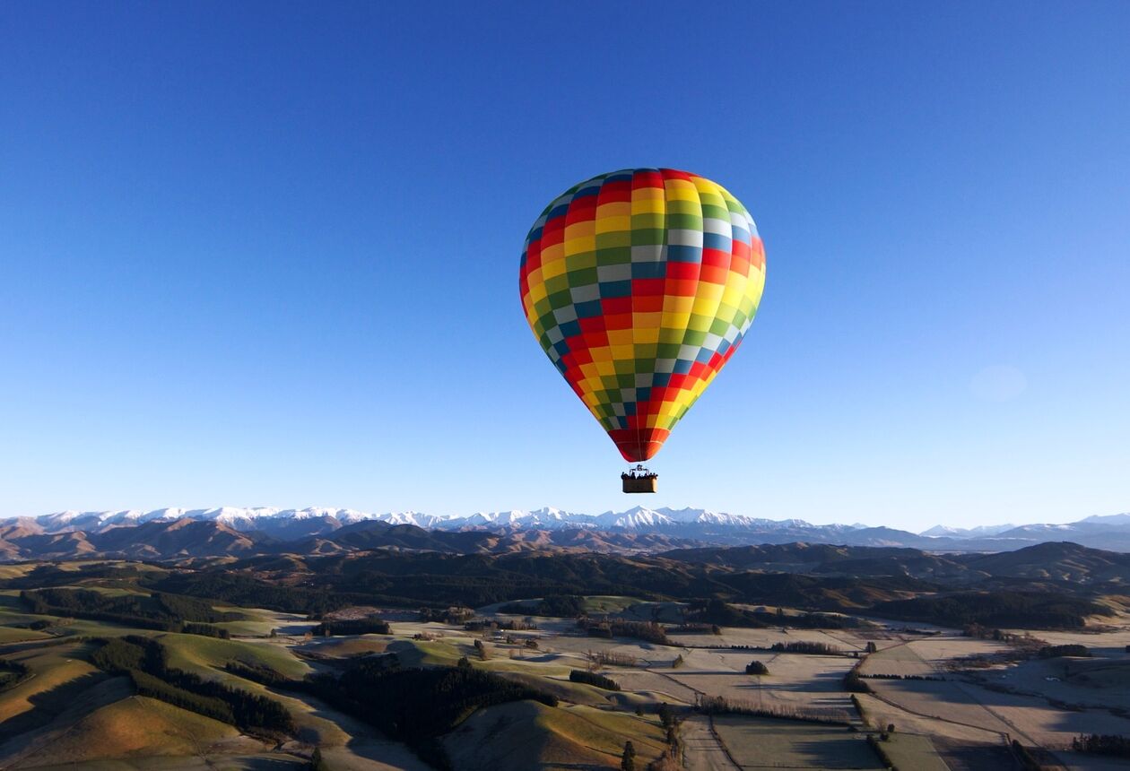 For a touch of romantic adventure, try taking in New Zealand’s diverse scenery from a hot air balloon