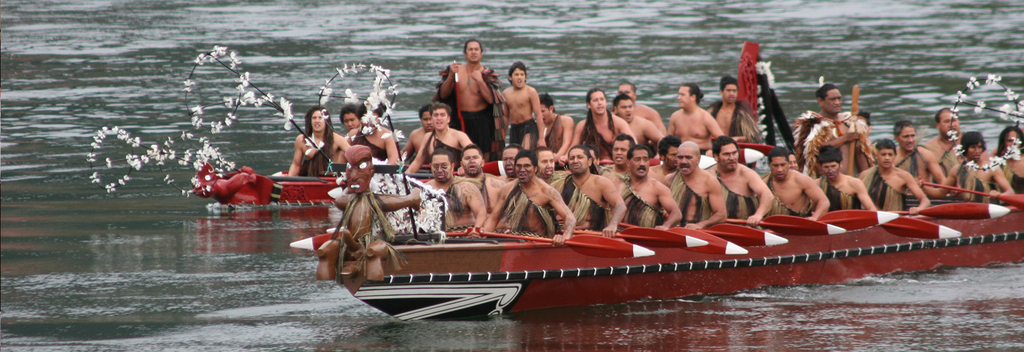 Maori canoes (waka) are paddled to honour the Maori King in Ngaruawahia
