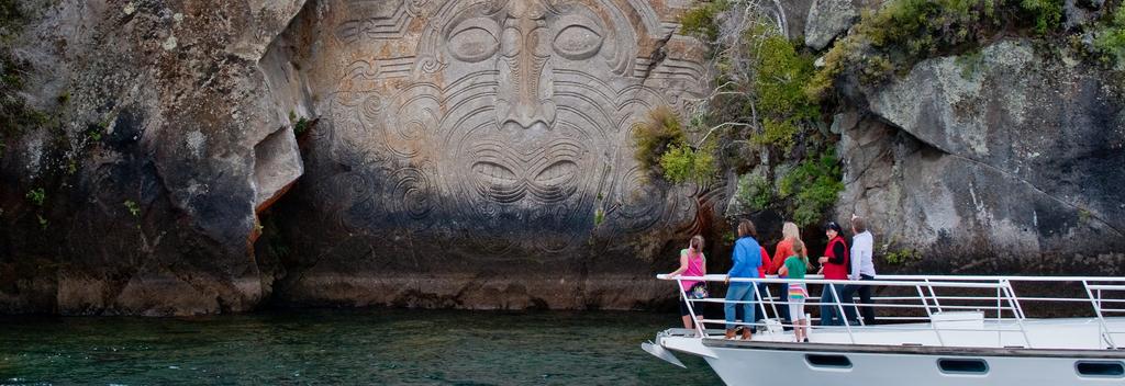 Viewing the Mine Bay Maori Rock Carvings by sailboat